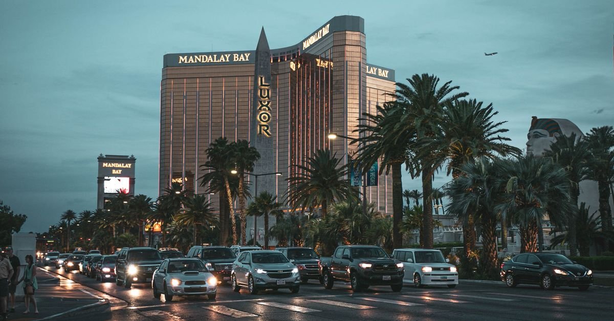 Evening view of Mandalay Bay with traffic in Las Vegas, showcasing a lively cityscape.